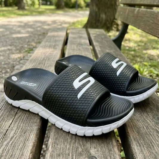 Ske_chers Comfort Slides – Black & White | In Stock